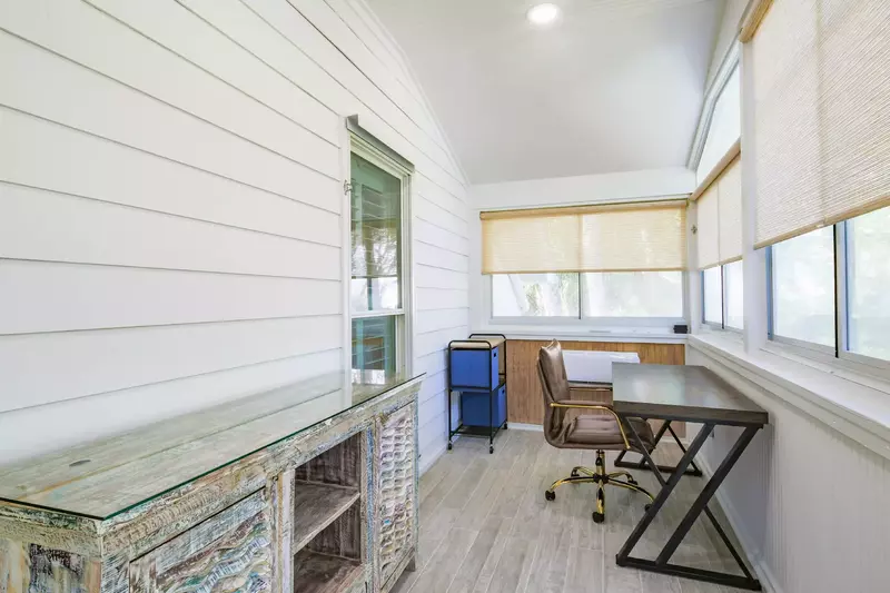 This desk in the sunroom in the master suite is the perfect spot for a work call.