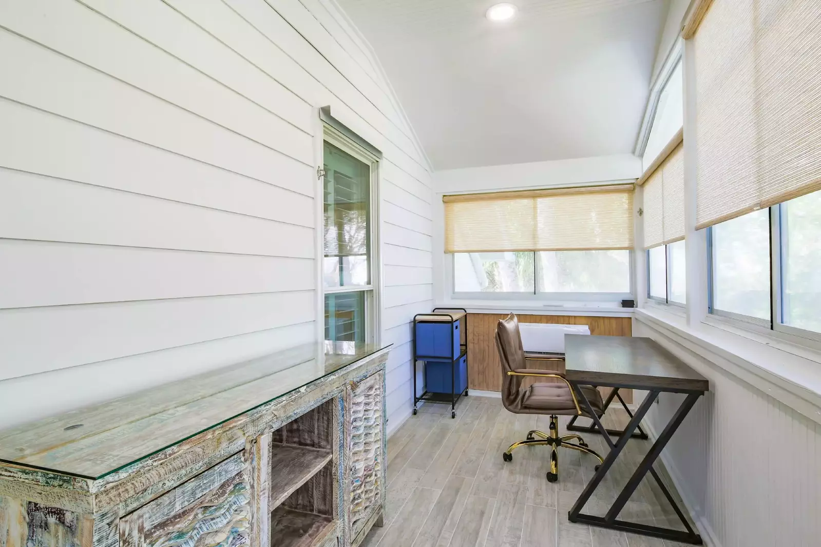 This desk in the sunroom in the master suite is the perfect spot for a work call.