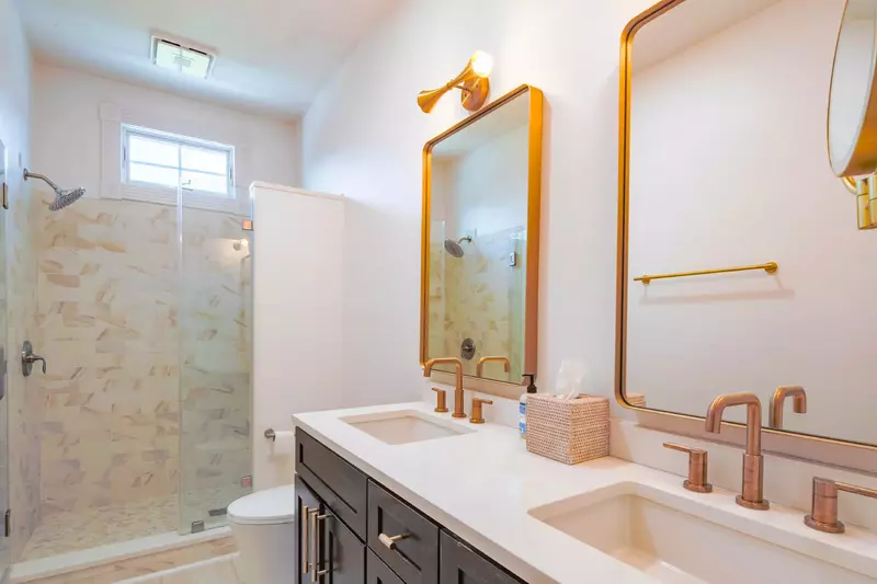 The master suite bathroom also has a beautifully tiled walk-in shower.