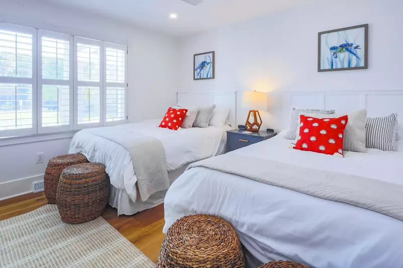 The queen bedroom looks out onto the home's front yard.