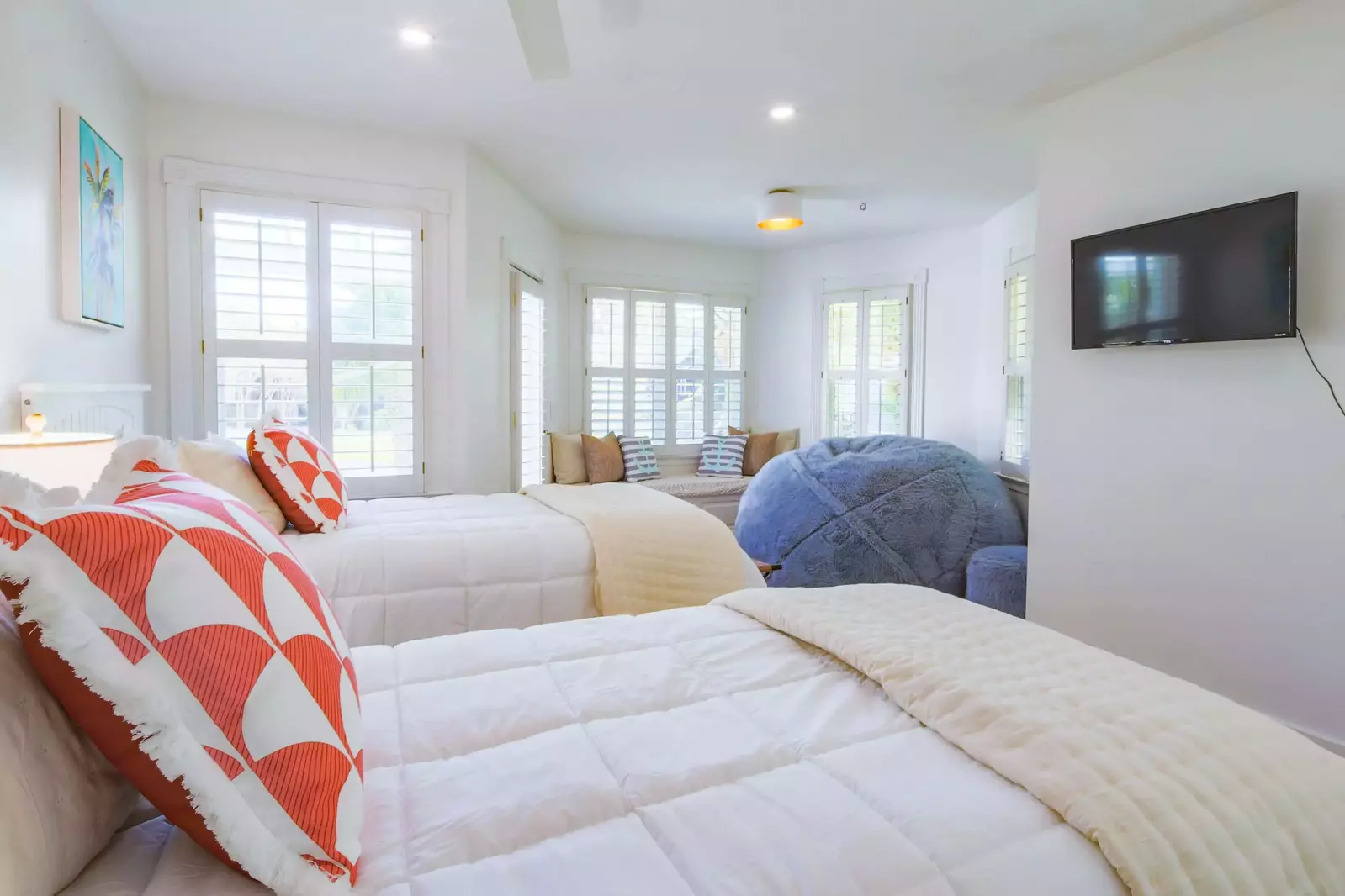 The twin bedroom also has access to the front deck, a smart TV and a seating area.