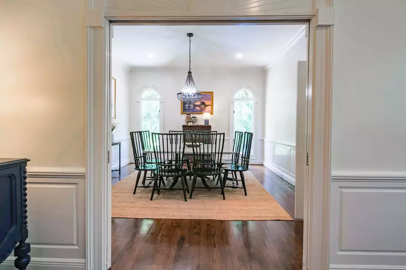 The formal dining room is located off of the living room and kitchen.