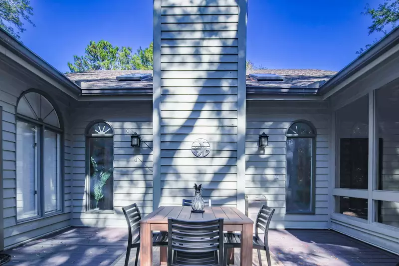 You can access the back porch from the sunroom.