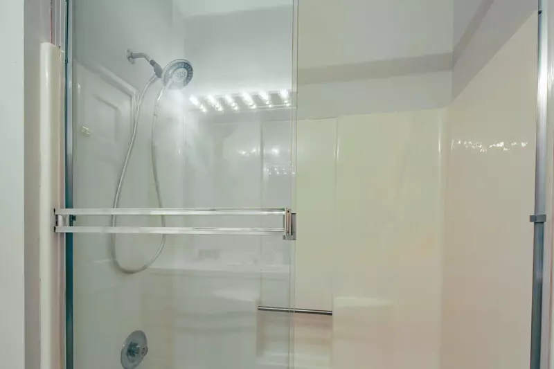 There is a walk-in shower in this en suite bathroom.