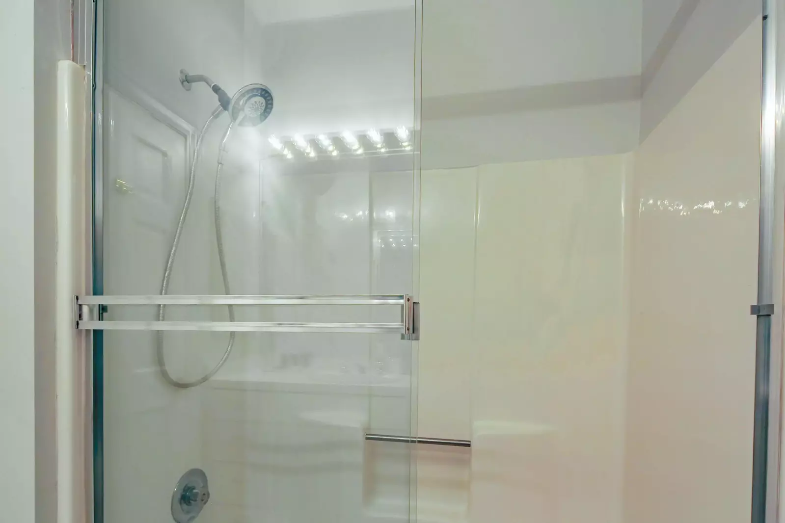 There is a walk-in shower in this en suite bathroom.