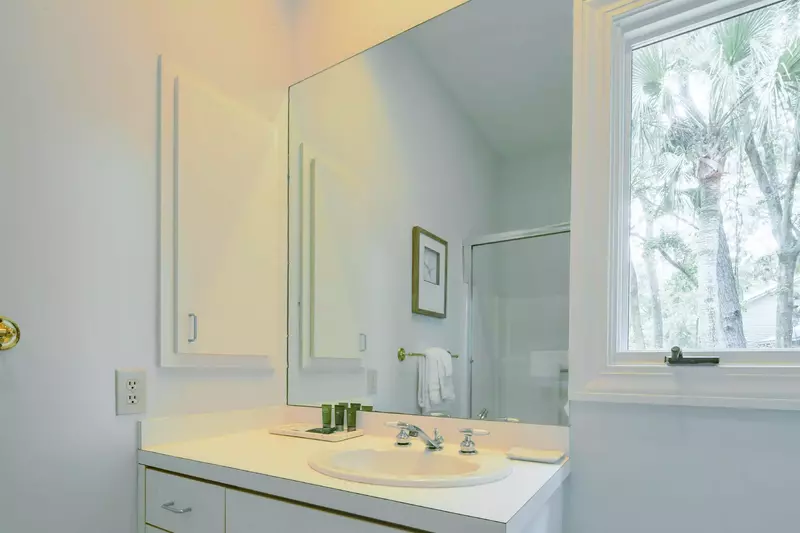 The second en suite bathroom features a spacious vanity.