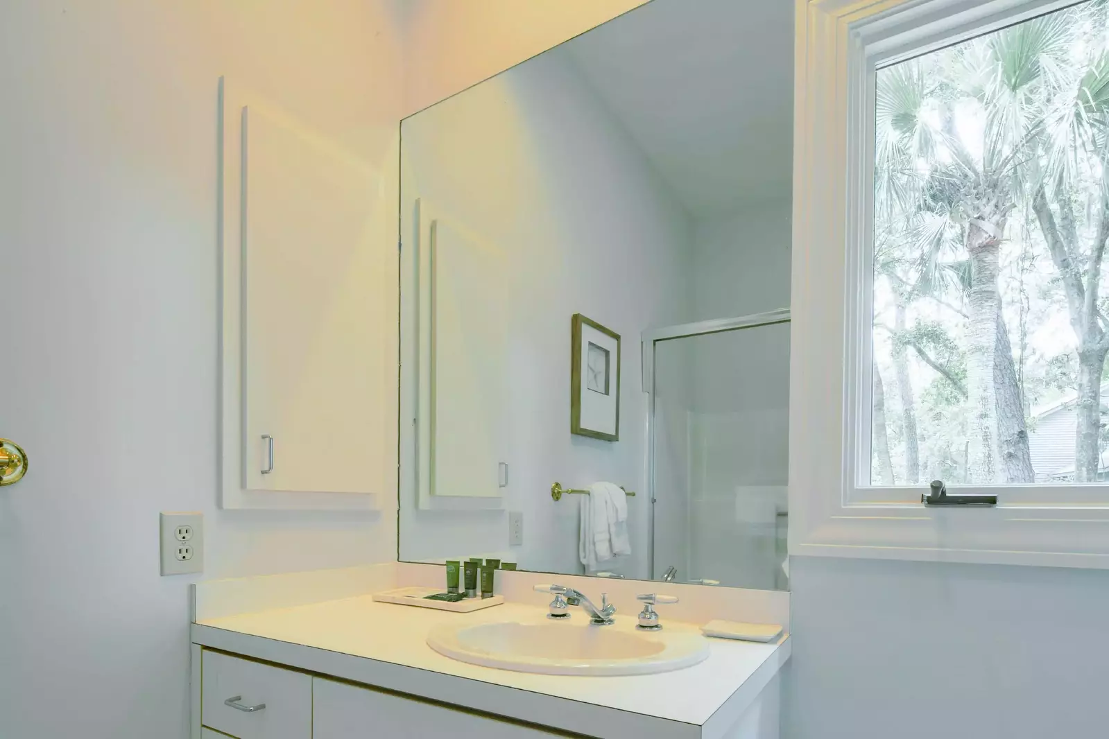 The second en suite bathroom features a spacious vanity.