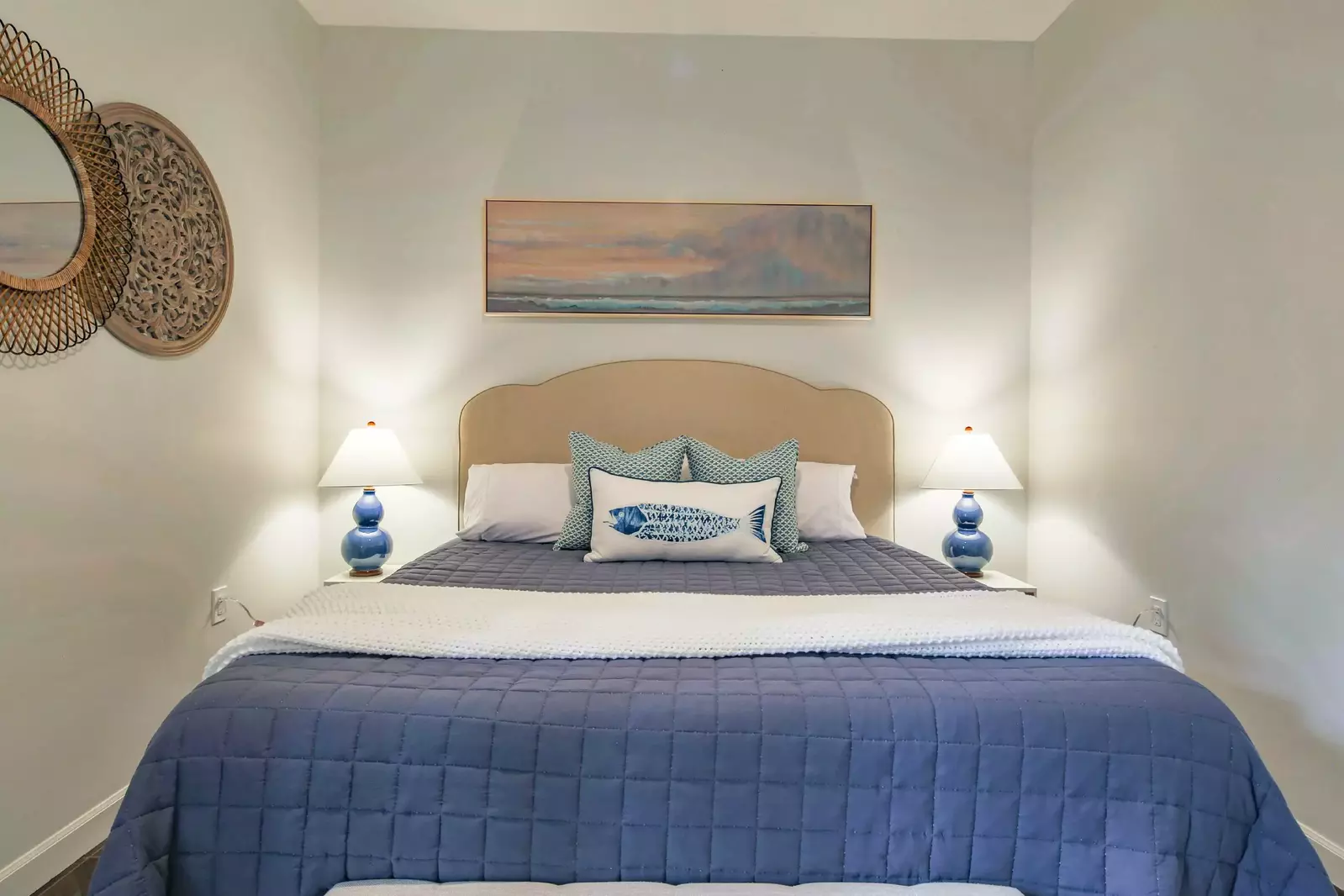 This room, like many of the rooms in the home, feature a coastal-themed decor and color pattern.