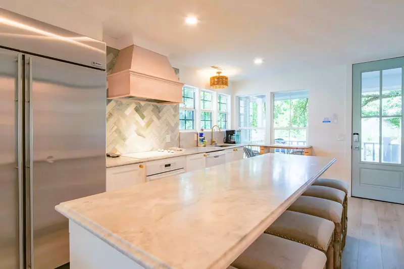 The Beach Cove features a gorgeous, fully renovated kitchen with a central island.