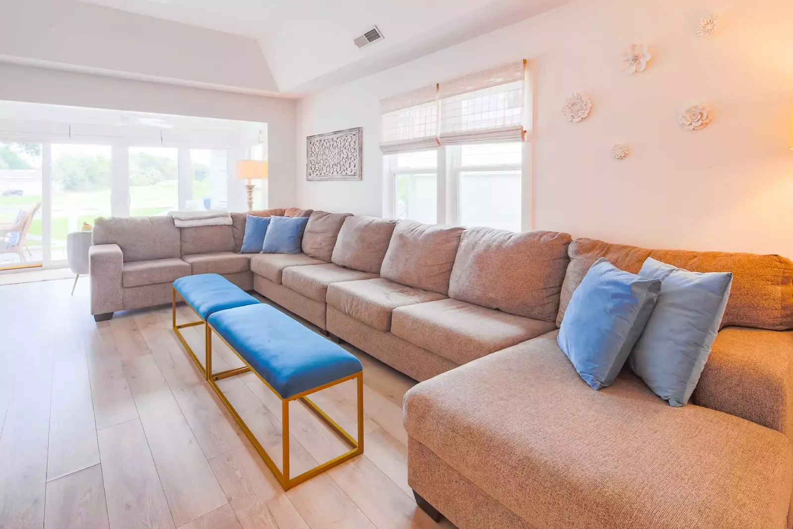 The Beach Cove features a comfortable living room with a large sectional.