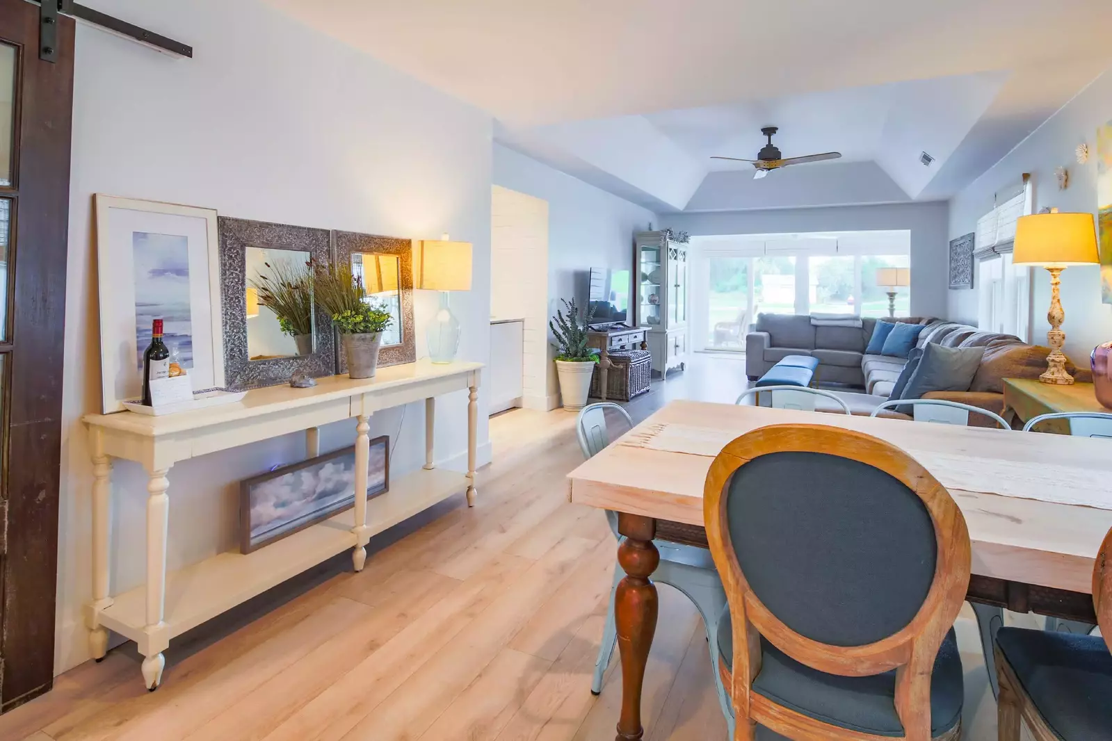 This dining table separates the kitchen from the living room.