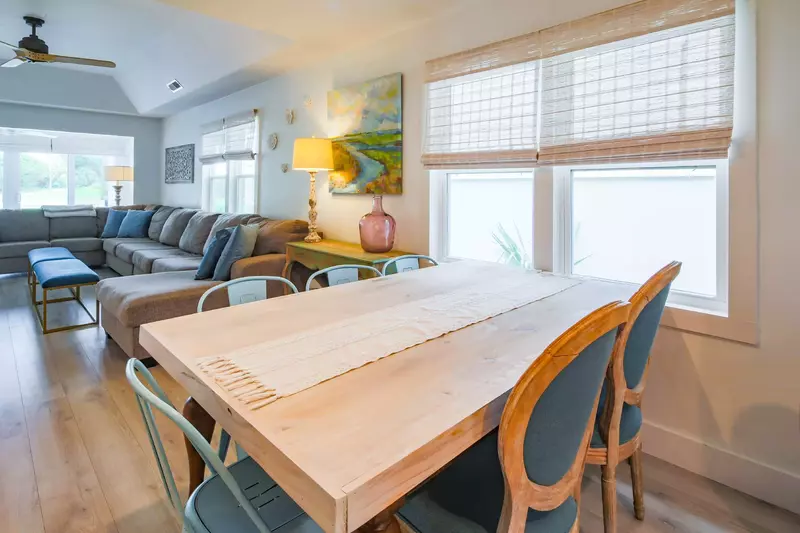 The dining table seats 6 and there are 6 stools at the kitchen island.