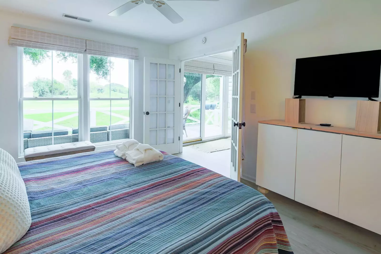 The master suite, which is located off the living room, features views of the golf course.