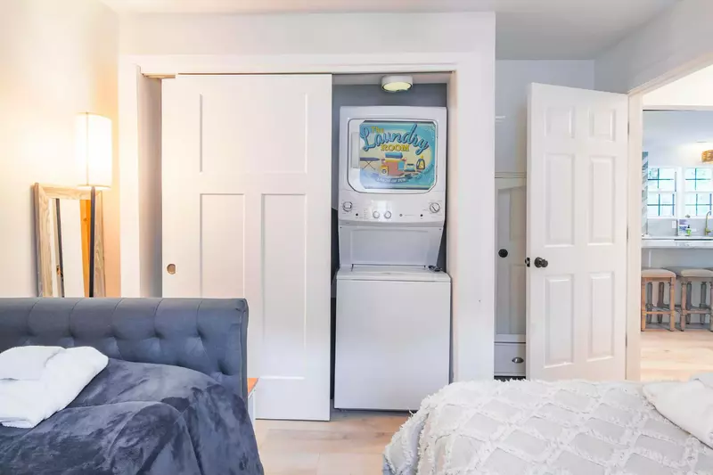 There is a stacked washing machine & dryer within the guest bedroom closet.