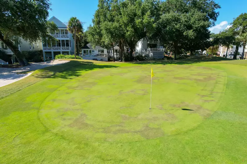 You can watch the golfers tackle the 4th hole of the Harbor Course from the home's back porch.