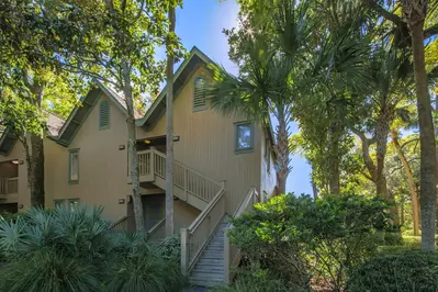 Palm Bungalow is a second floor unit located up this exterior staircase.