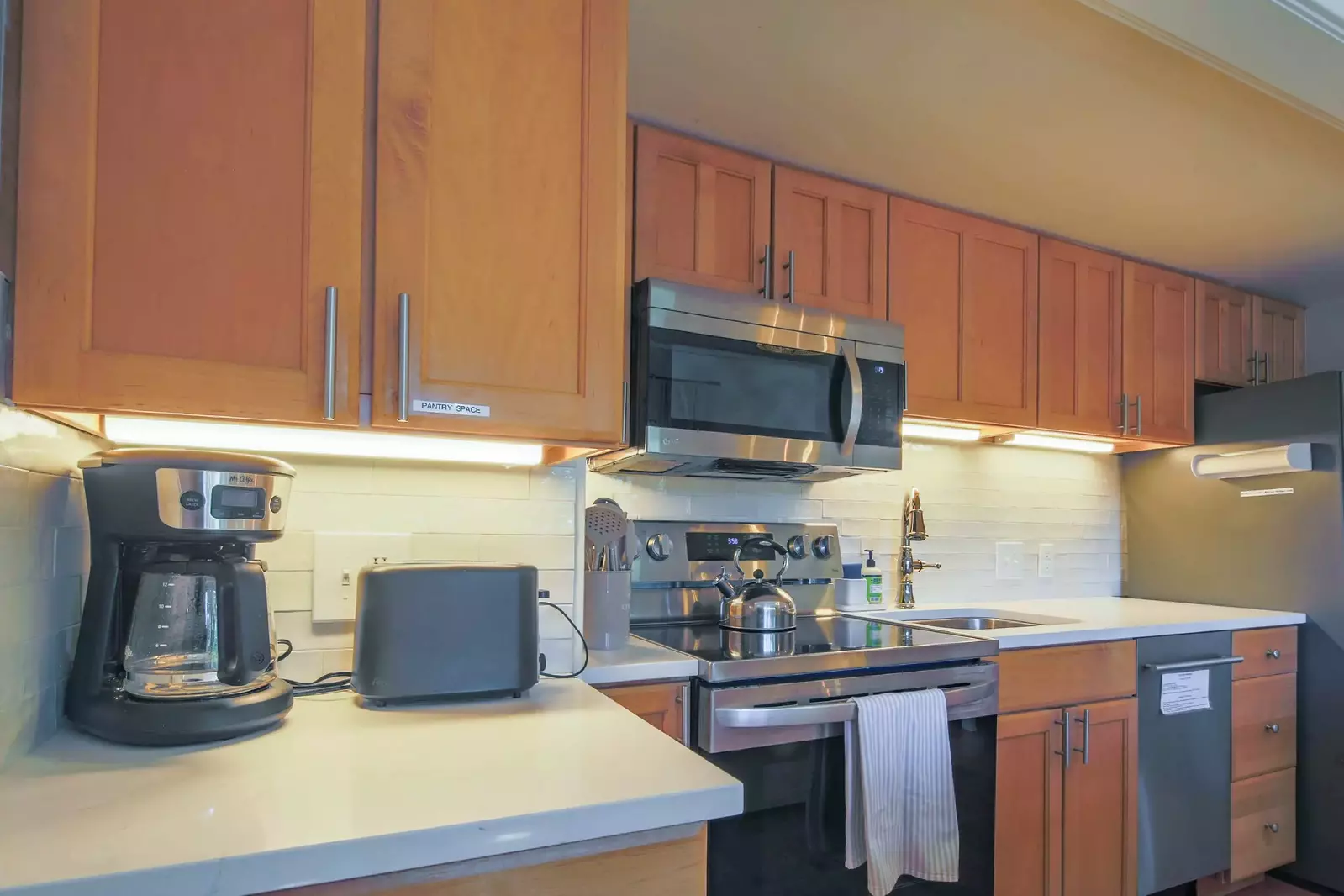 The kitchen also has a drip coffee maker, toaster and tea kettle.