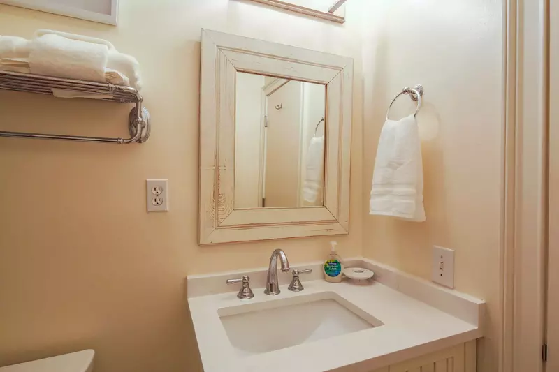 The bathroom features a spacious vanity.