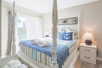 The master suite, which features a queen bed, is located on the townhome's lower level.
