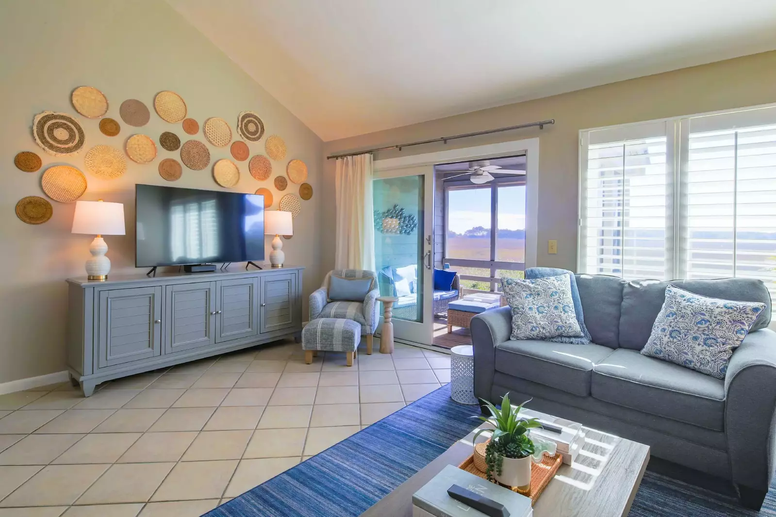 The sliding glass door in the living room leads to the screened porch.