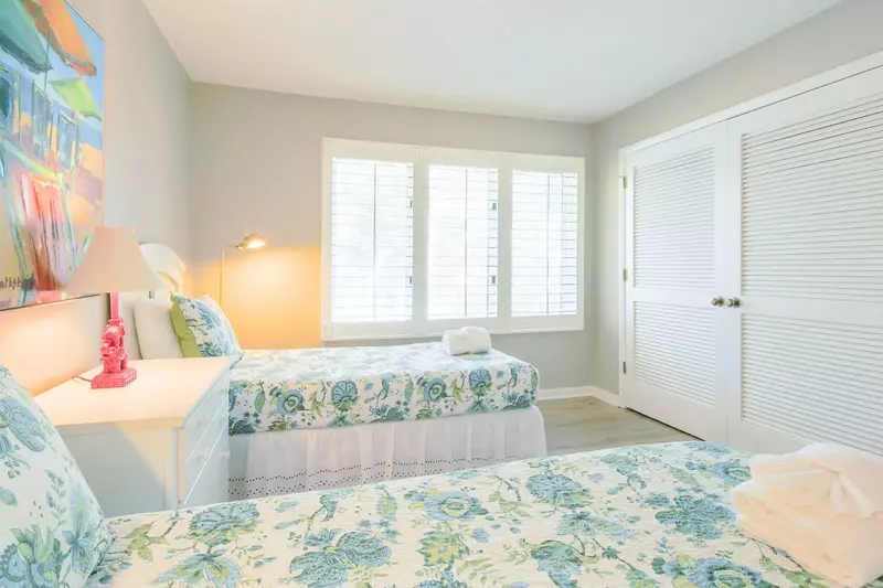 This guest suite receives lovely natural light through the large window.
