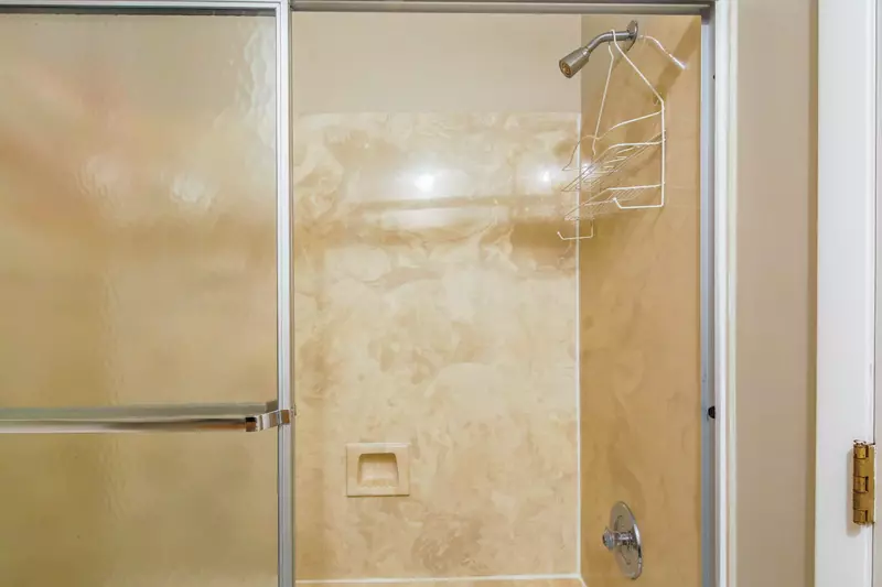 The en suite bathroom also has a shower/tub combo.