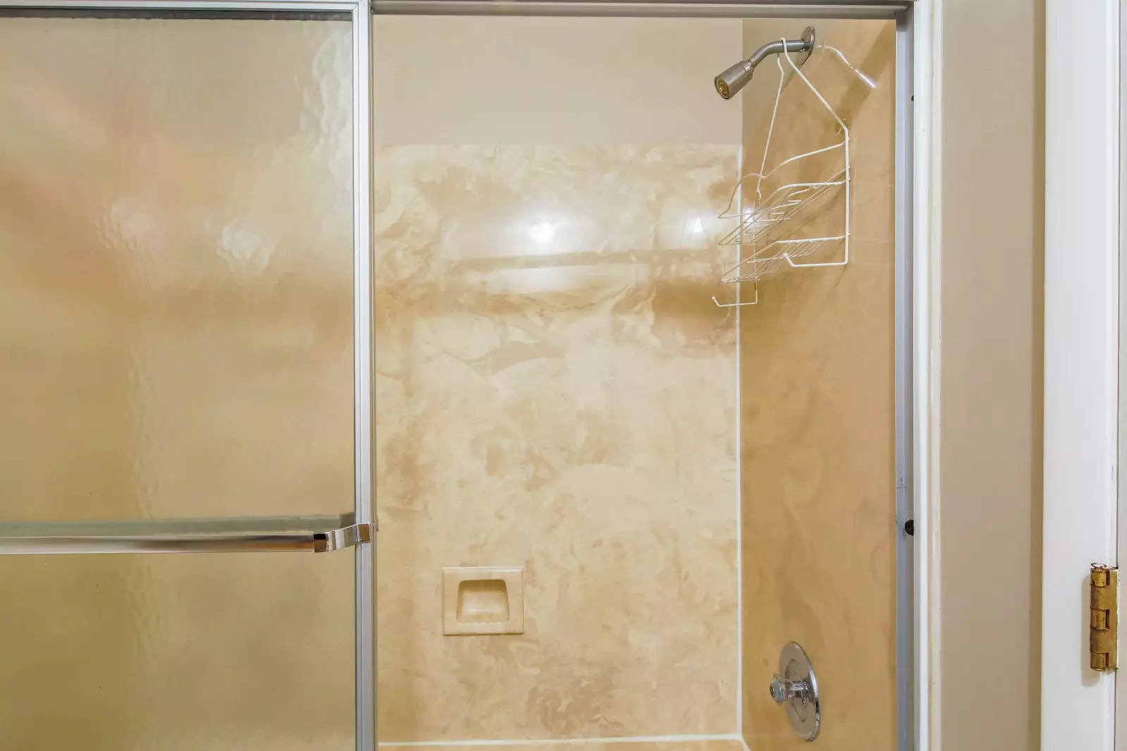 The en suite bathroom also has a shower/tub combo.