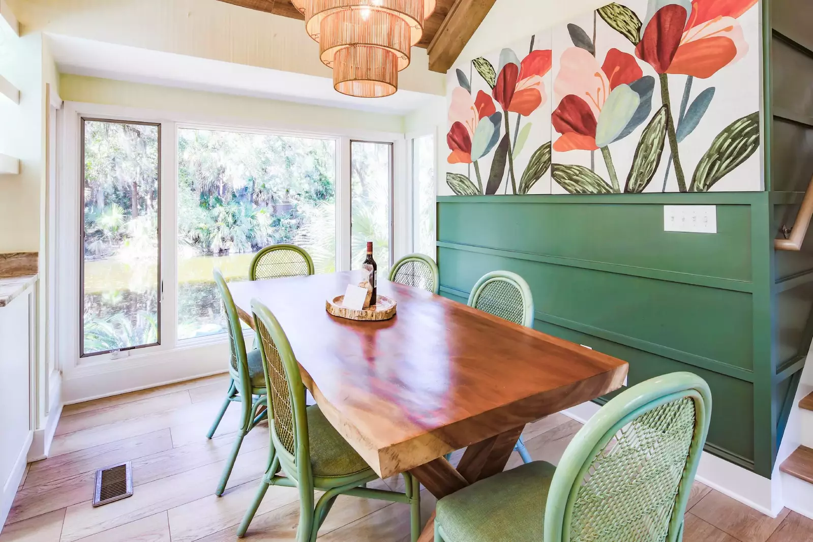 The kitchen table features stunning views of the lagoon behind the home.