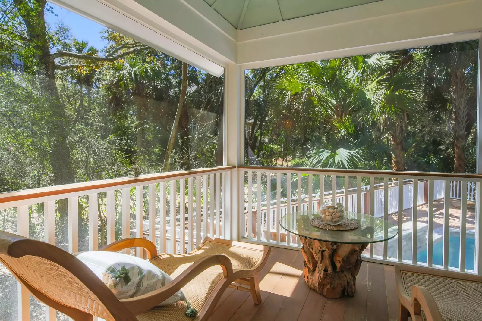 The master suite leads out to the screened porch that overlooks the pool.