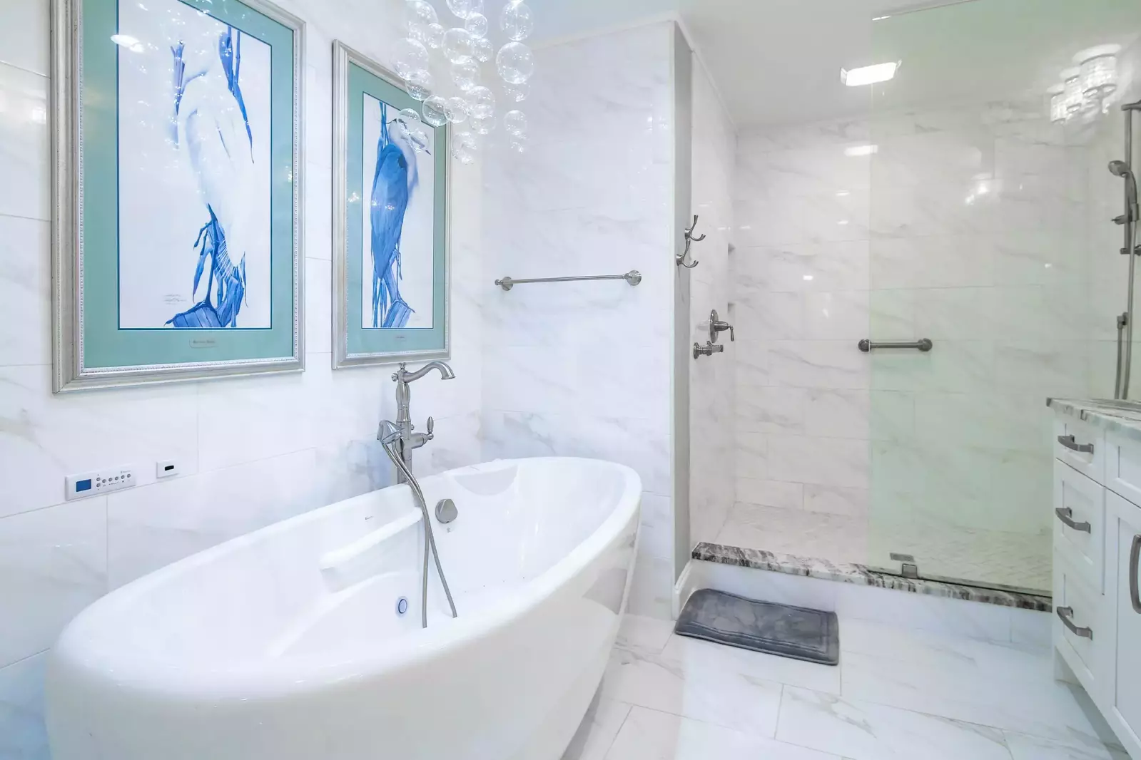 The master suite has a soaking tub and a tiled, walk-in shower