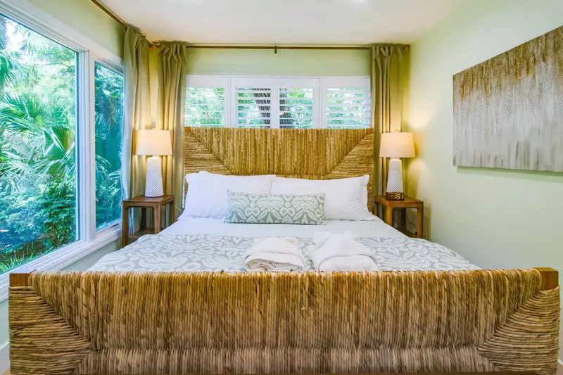 This lower level king suite features a king bed and night stands with reading lamps.