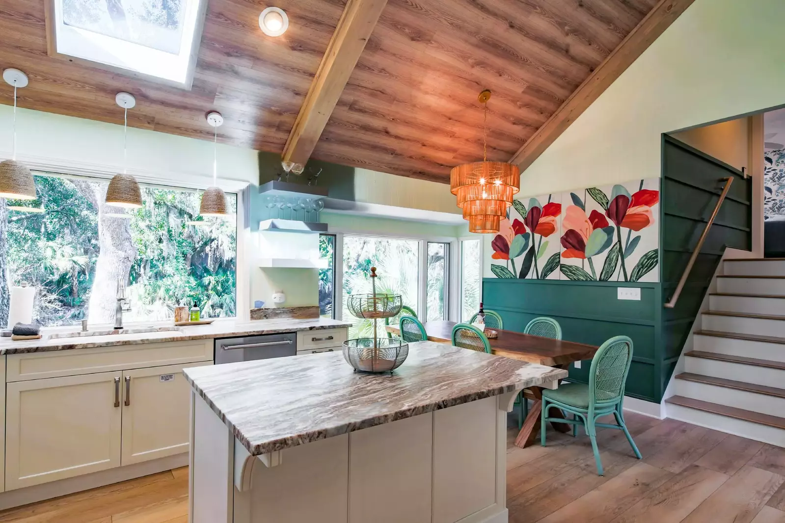 These stairs near the kitchen take you to two of the home's suites.
