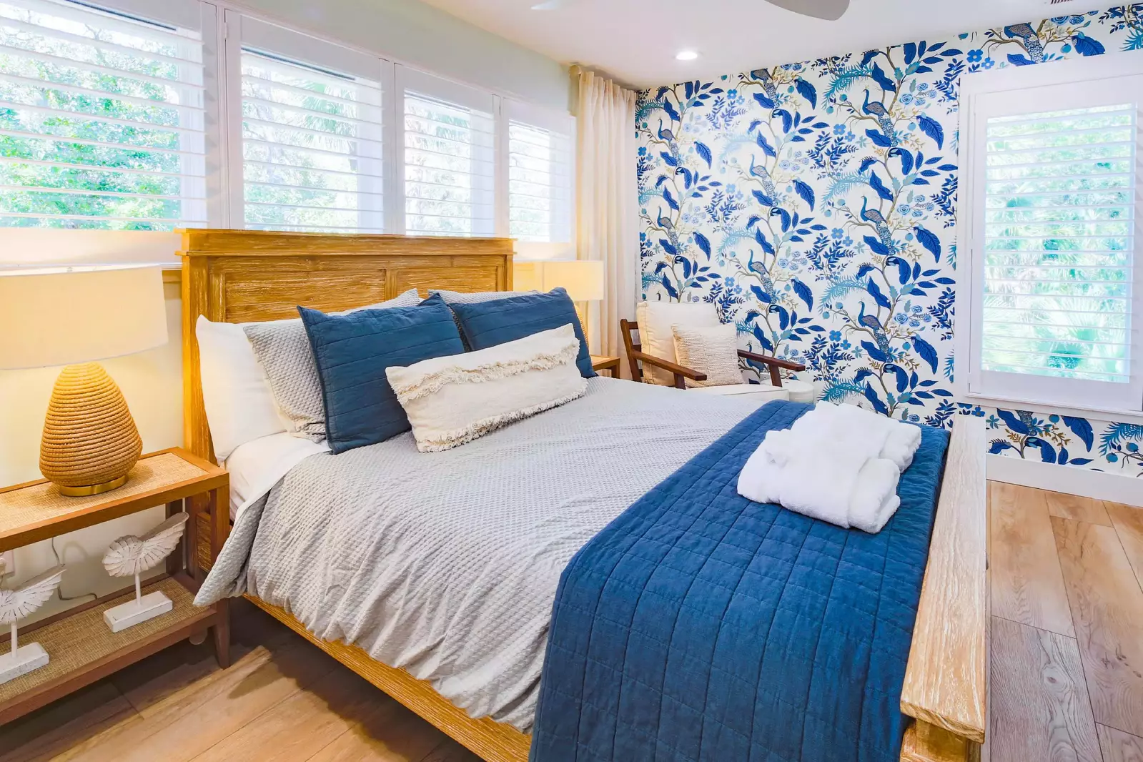 The upper level queen suite features a queen bed and night stands with reading lamps.