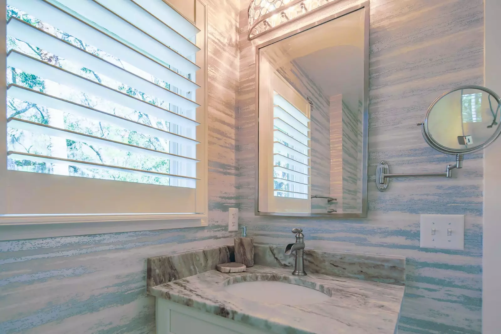 The en suite bathroom for the queen suite features a spacious vanity.