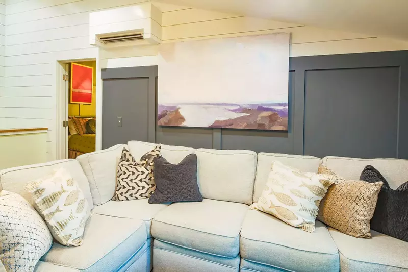 The den features a large sectional and is a great room for your kids to gather and play.
