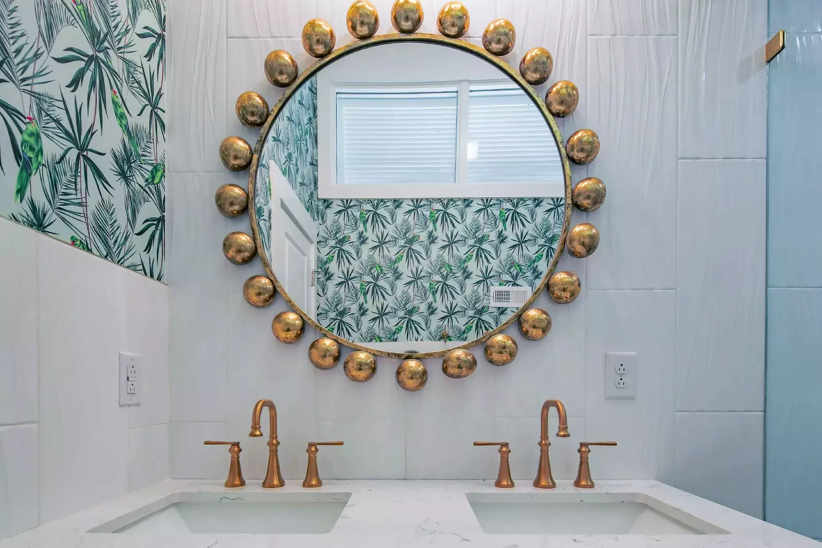 This hallway bathroom with a dual sink vanity is shared by the bunk bedroom and the twin bedroom.