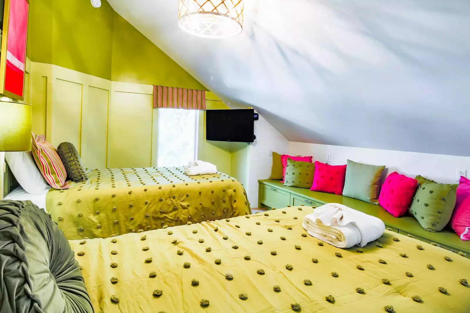 There is also a bench the spans the width of the room near the foot of the beds.