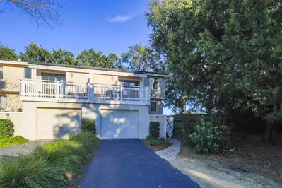 Happy Place is a two-story, end unit within the Fairway Dunes community.