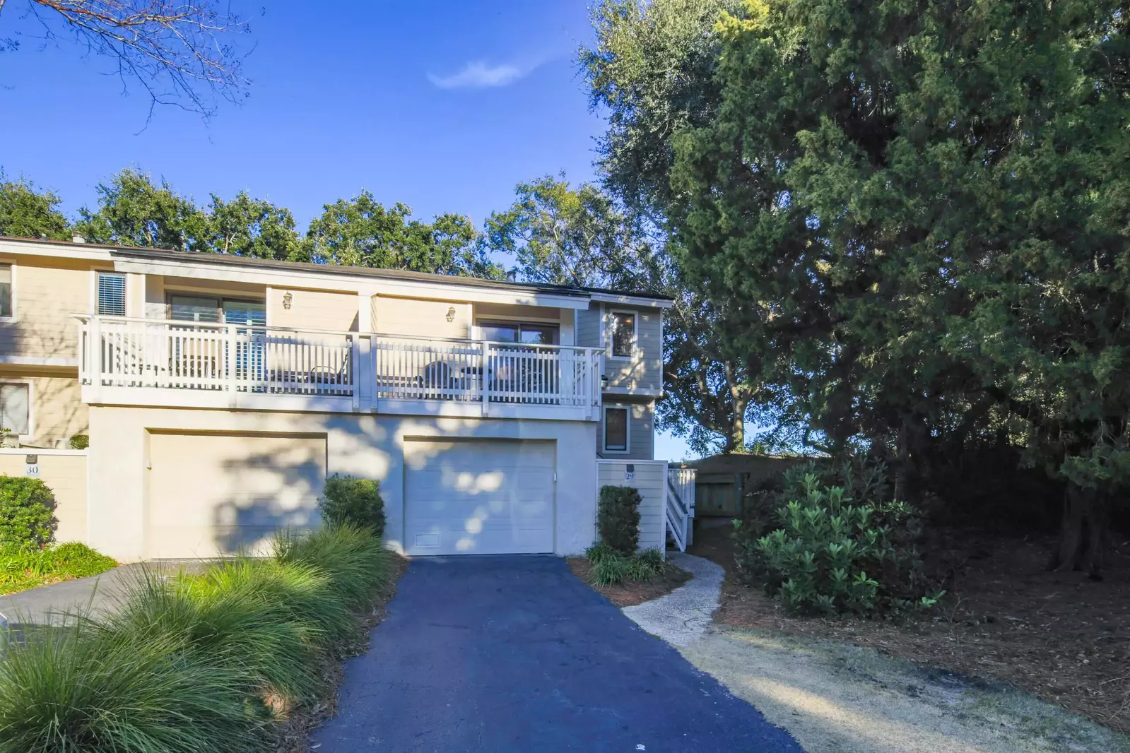 Happy Place is a two-story, end unit within the Fairway Dunes community.