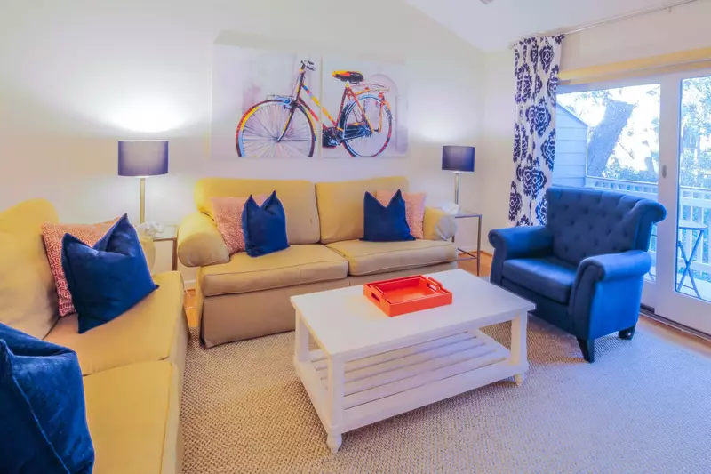 The living room features golf course views and sliding door access to the back porch.
