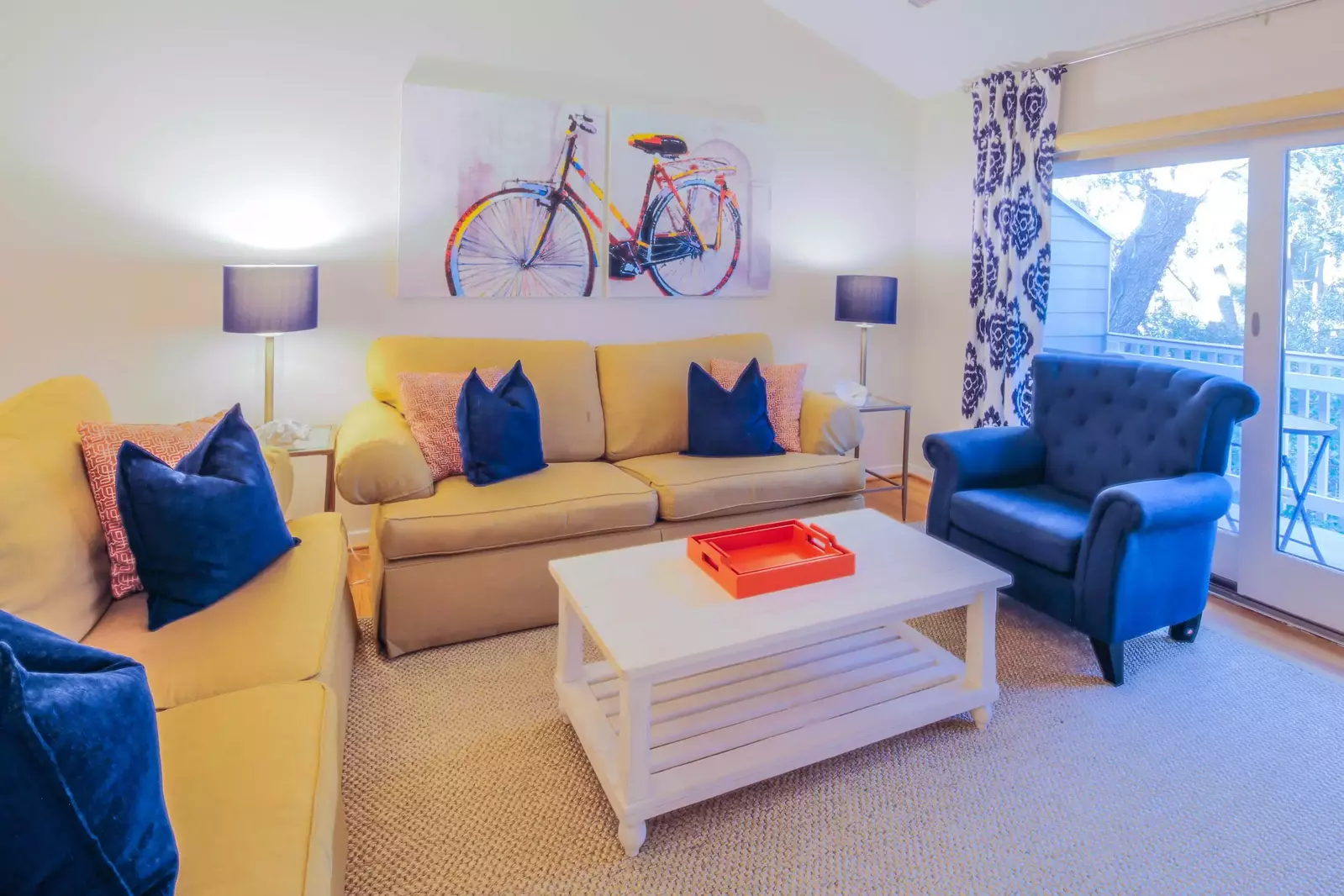 The living room features golf course views and sliding door access to the back porch.