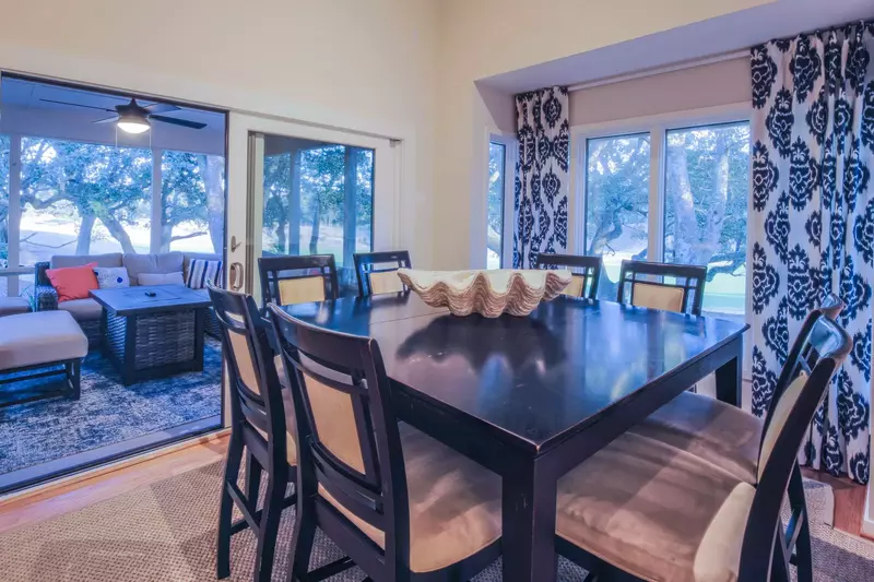 The dining area connects to the fabulous screened porch.