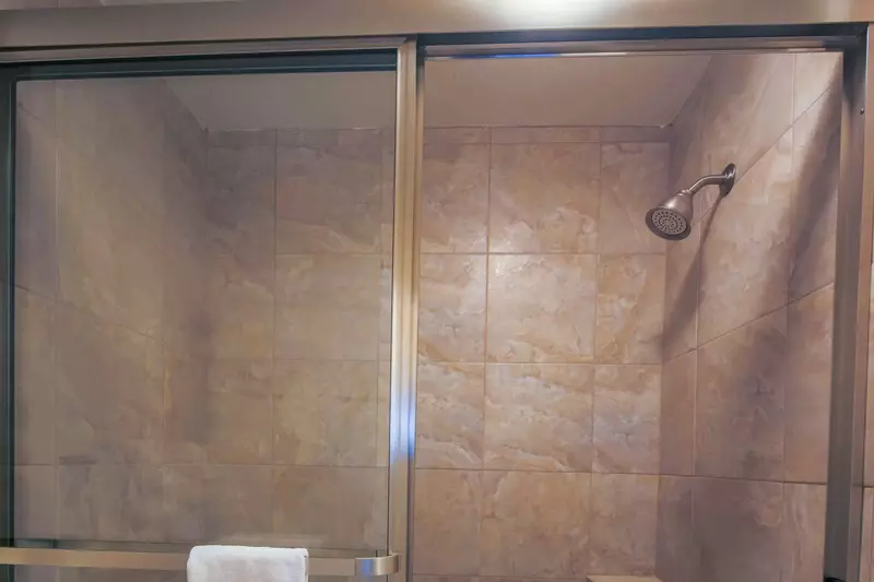 There is also a tiled shower/tub combo in this bathroom.