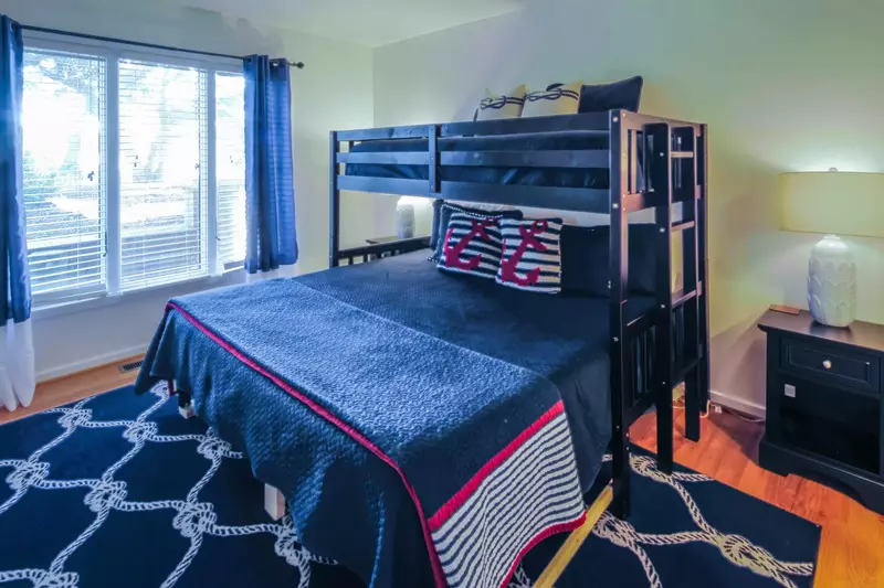 This guest suite also features two night stands with reading lamps.
