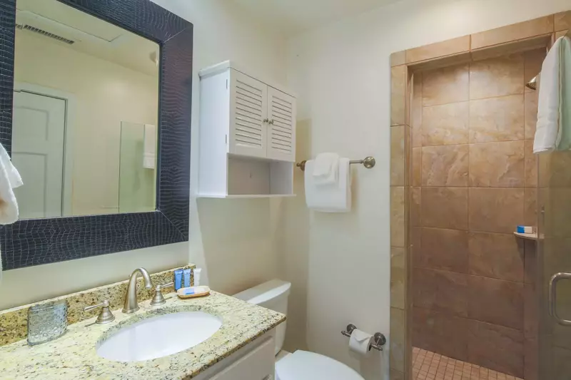 This en suite bathroom for the bunk bedroom has plenty of room to store your personal items.