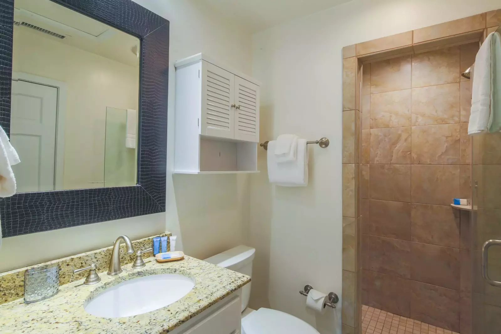 This en suite bathroom for the bunk bedroom has plenty of room to store your personal items.