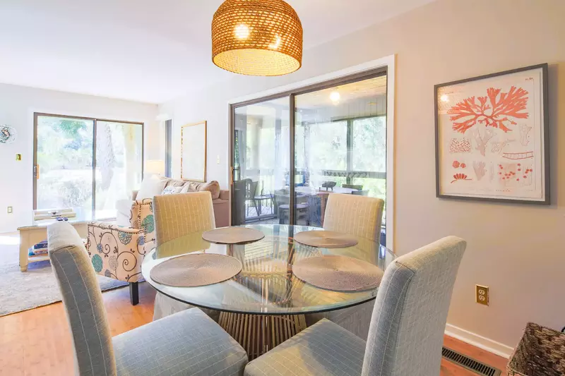 The dining table seats 4. There is an additional dining table on the screened porch.