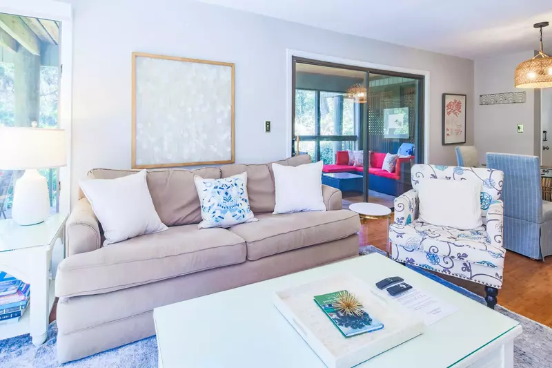 You may access the screened porch through the sliding glass door near the dining table.