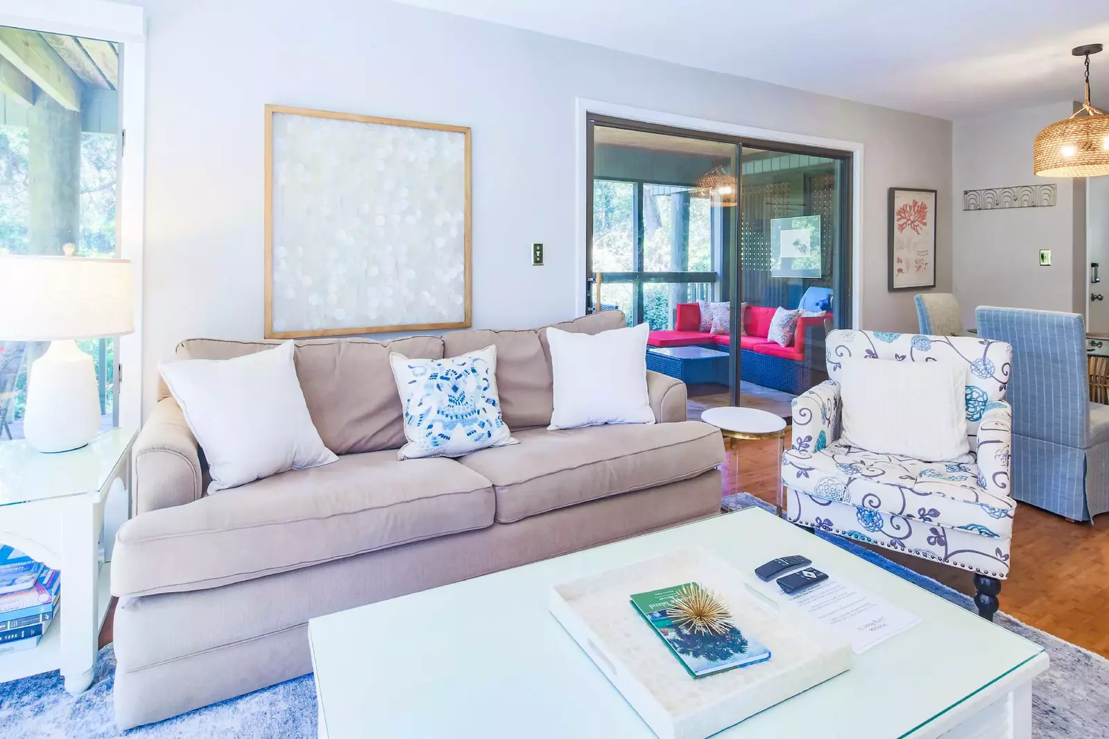 You may access the screened porch through the sliding glass door near the dining table.
