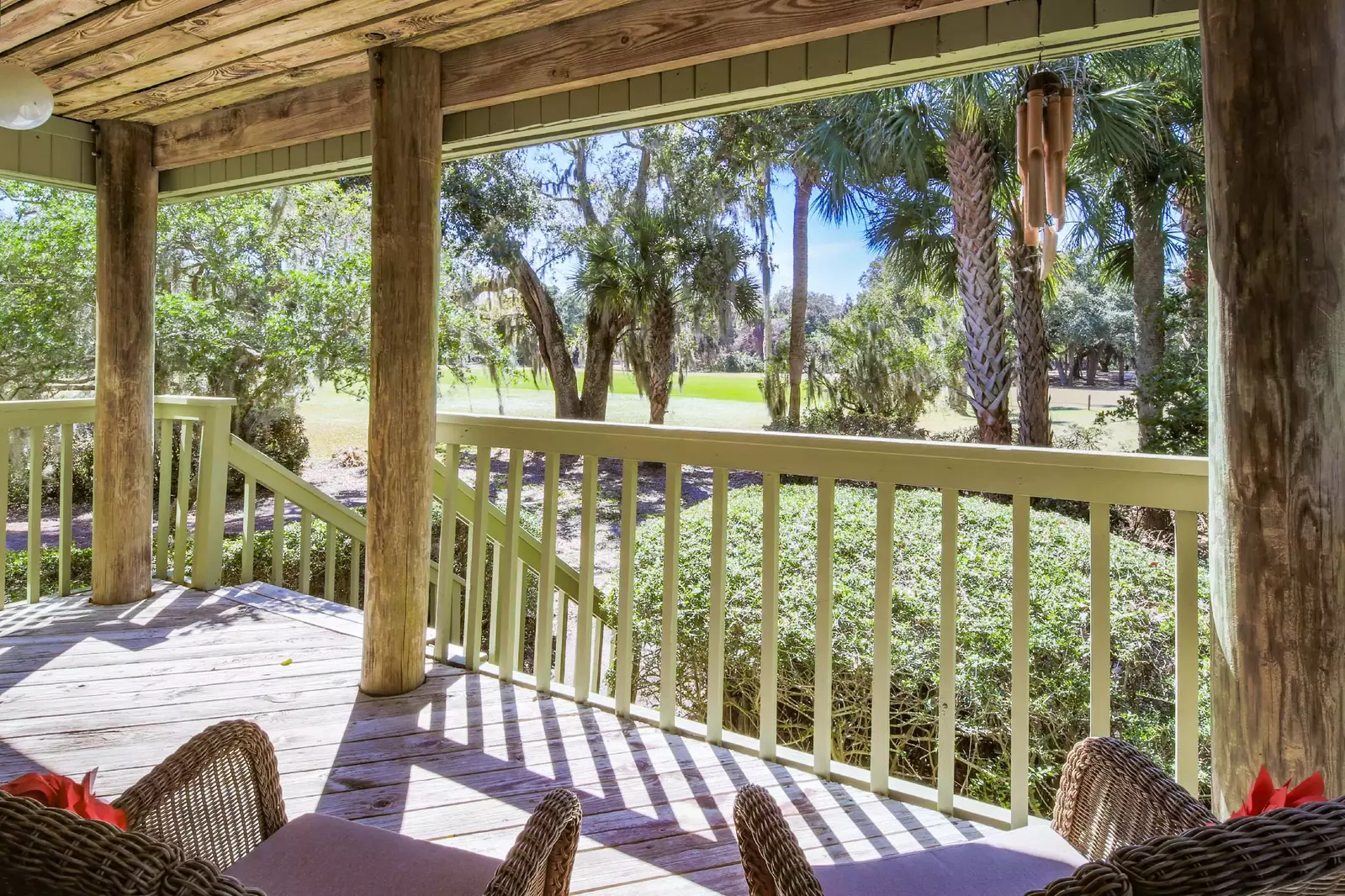 The covered porch looks out onto Night Heron Park.